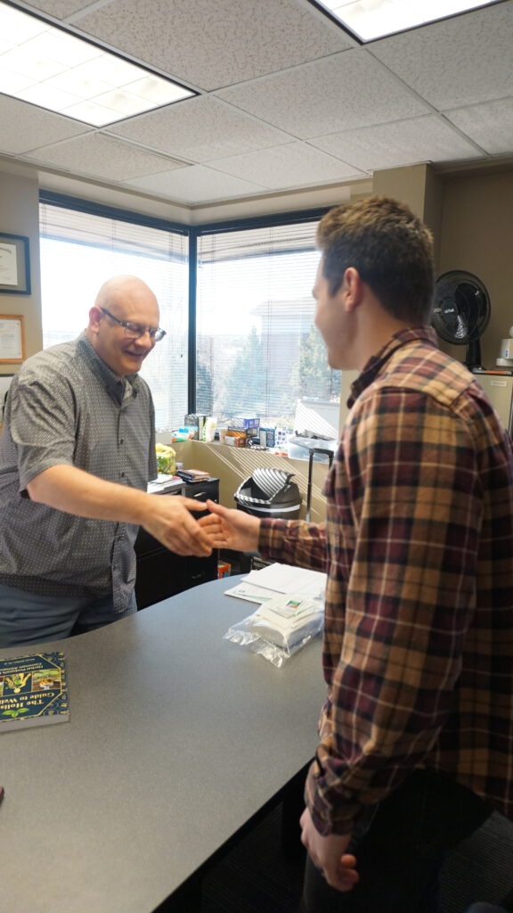 Jason shaking hands with a patient after discussing treatment plans, payment options and how to help the patient.