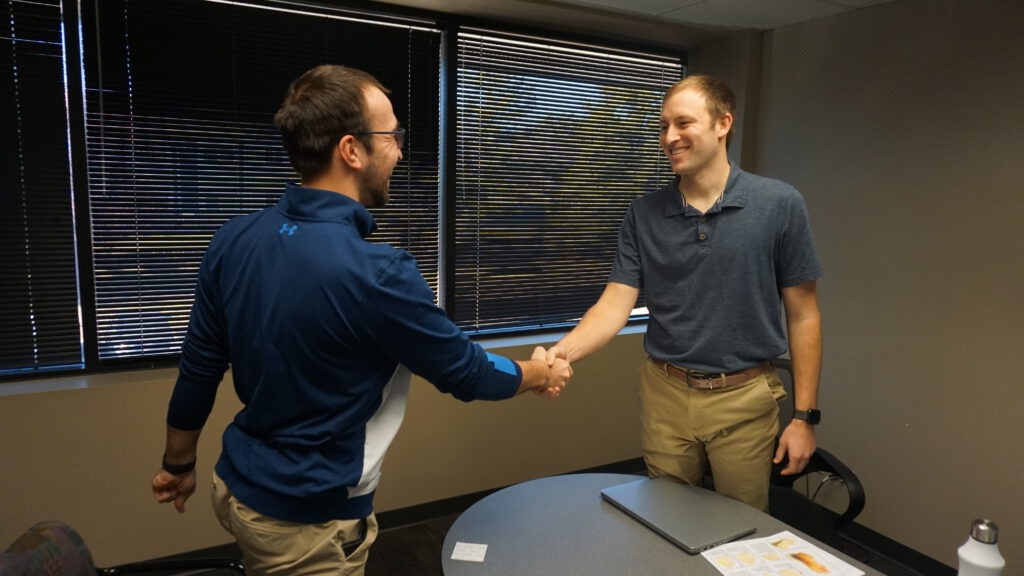 Gabriel meeting with a patient about their personalized healthcare plan. 